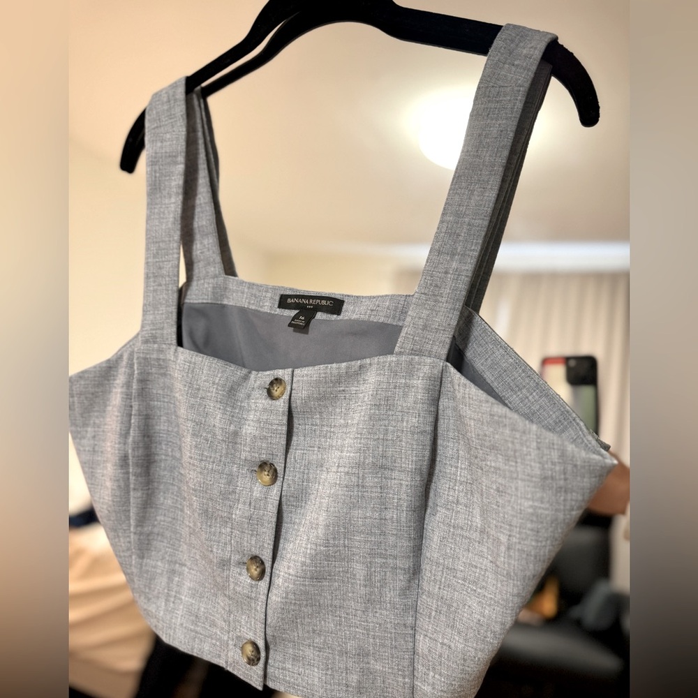 Blue linen like cropped button down top. Top is lined. New/never worn. Size 16